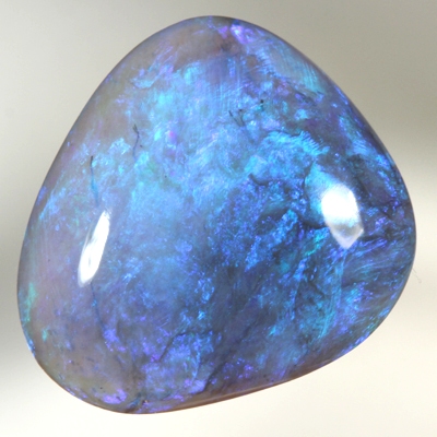 SOLID BLACK CRYSTAL OPAL Lustrous colours of gold green turquoise to blue and purple